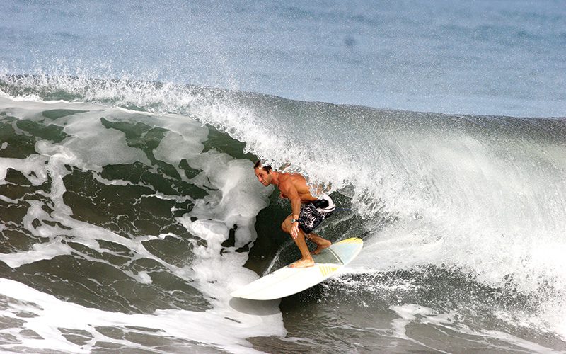 Marcel Oliveira surfing a big wave