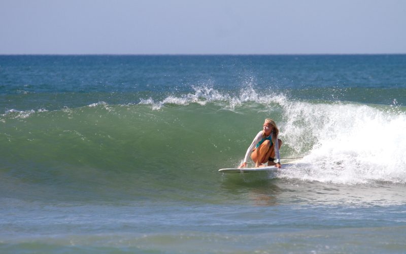 woman surfer playa tamarindo beach costa rica